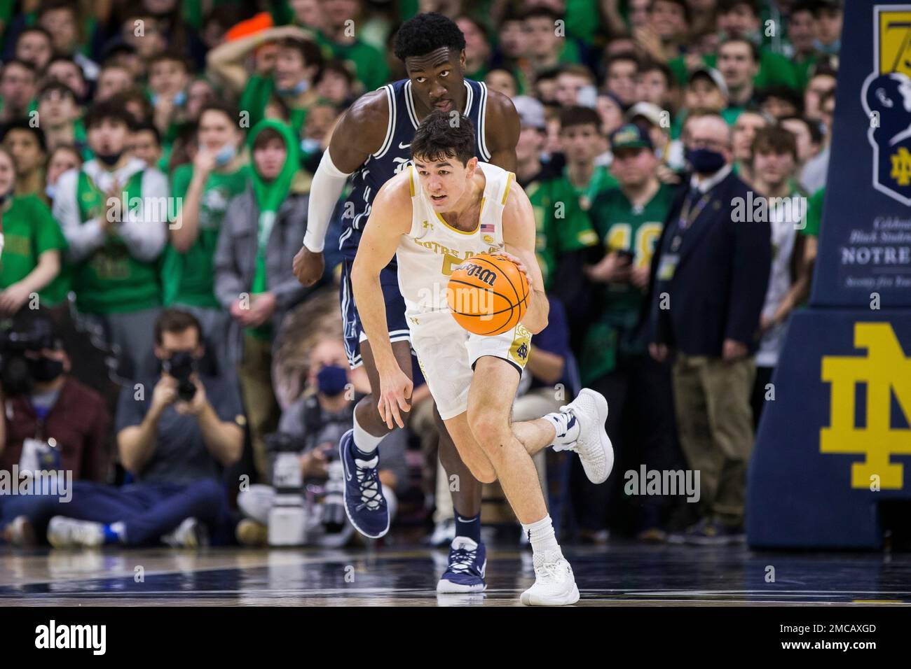 Notre Dame's Cormac Ryan (5) drives downcourt in front of Duke's Mark