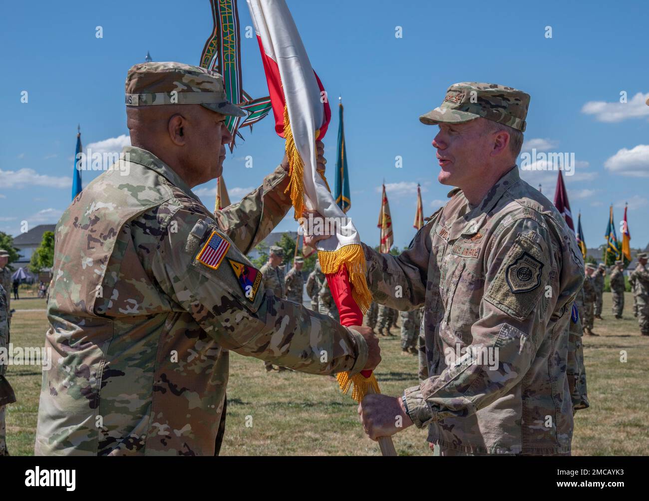 Gen. Darryl Williams, incoming commander of U.S. Army Europe & Africa (USAREUR-AF) receives the colors from Gen. Tod D. Wolters, commander of U.S. European Command and NATO's Supreme Allied Commander Europe (SACEUR), during the USAREUR-AF Change of Command Ceremony at Clay Kaserne, Wiesbaden, Germany, June 28, 2022. Stock Photo