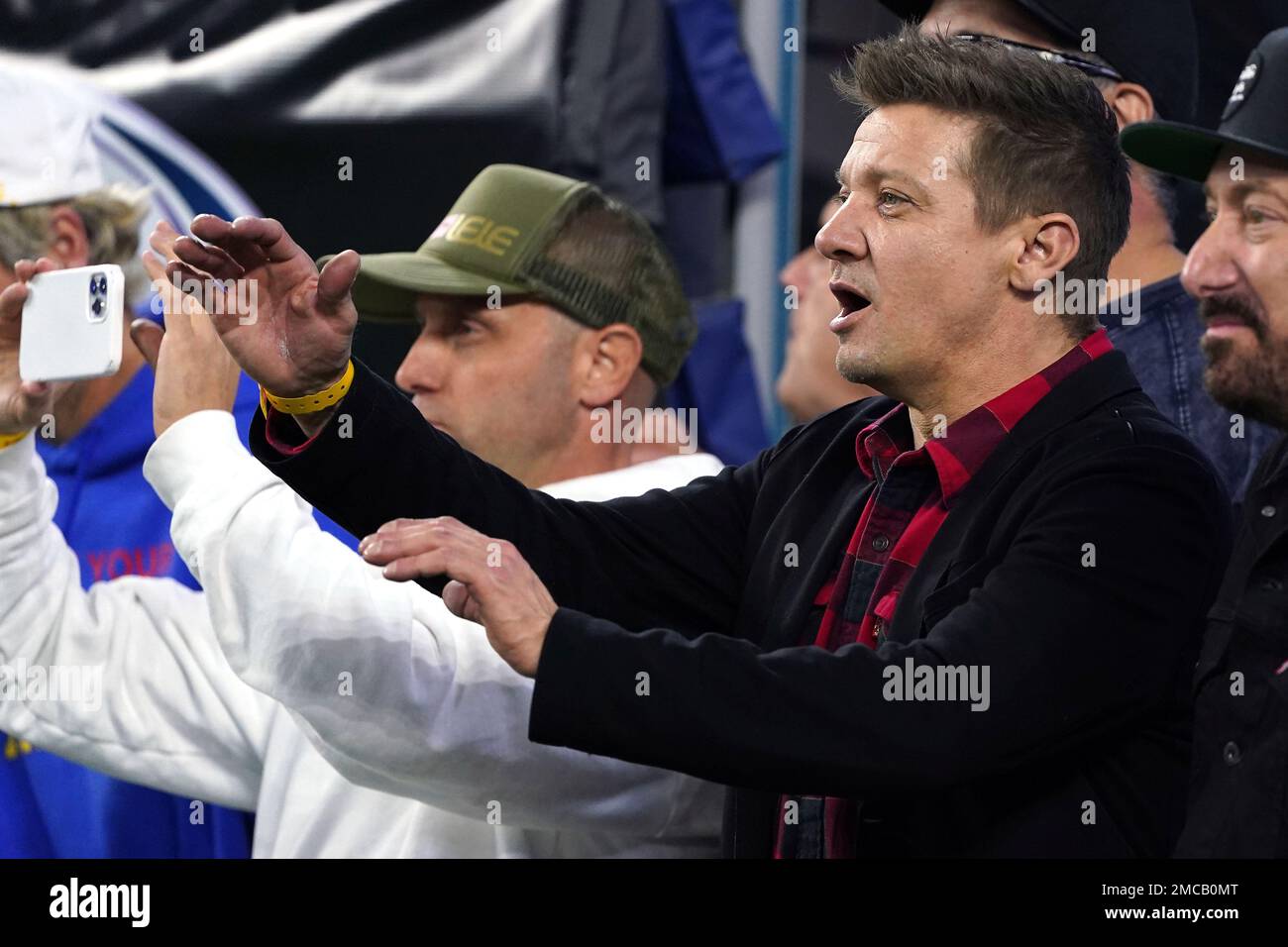 Actor Jeremy Renner watches the Los Angeles Rams take on the San Francisco  49ers during the NFL NFC Championship game, Sunday, Jan. 30, 2022 in  Inglewood, Calif. The Rams defeated the 49ers