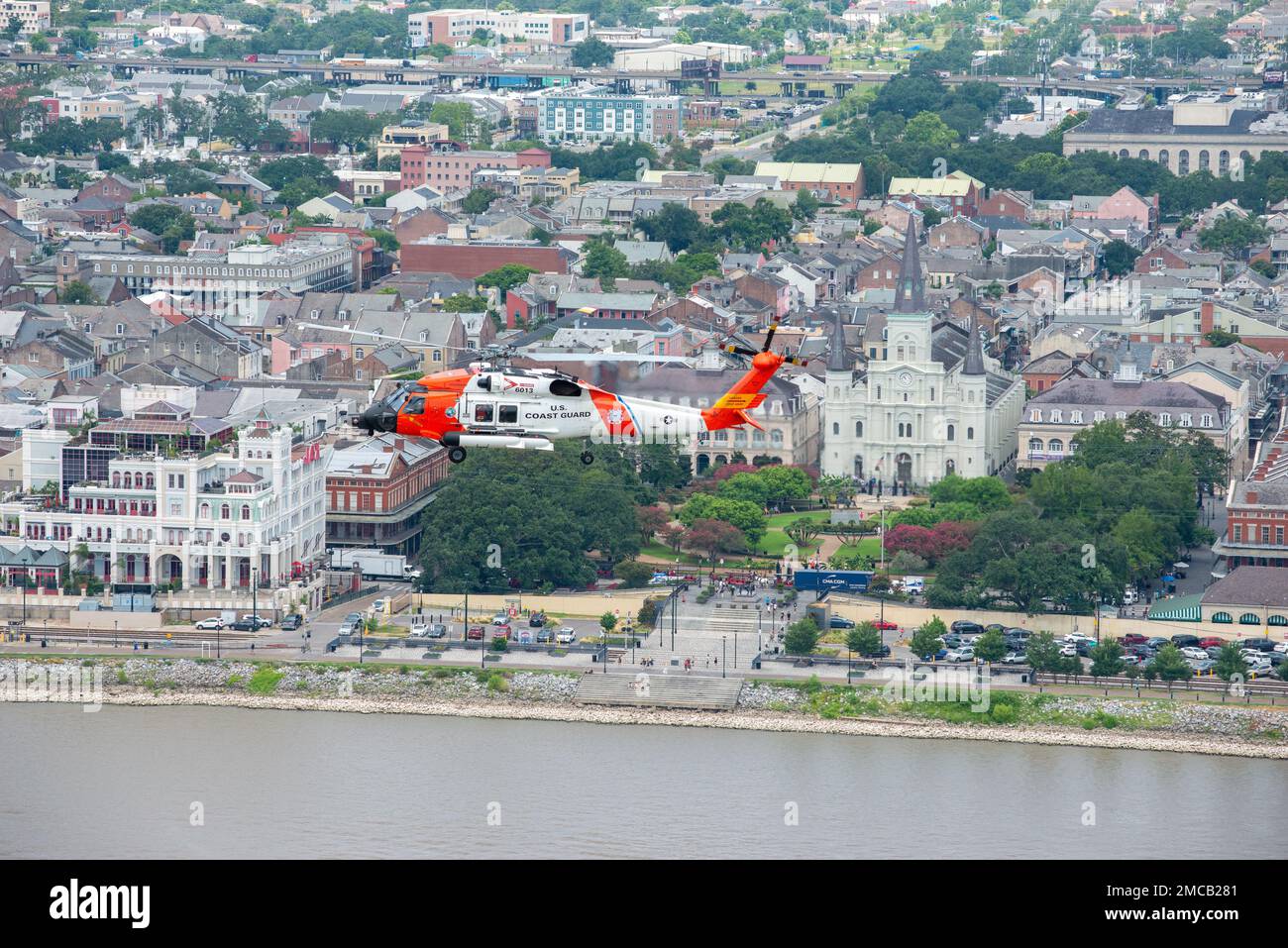 Air Station New Orleans MH-60 helicopter flies over Jackson Square following a formation flight June 28, 2022 in New Orleans, LA.  The MH-60 helicopters will be replacing the MH-65’s at Air Station New Orleans after a transitional period. Stock Photo