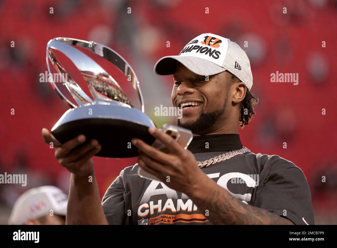 Cincinnati Bengals running back Joe Mixon holds the Lamar Hunt trophy after  the AFC championship NFL football game against the Kansas City Chiefs,  Sunday, Jan. 30, 2022, in Kansas City, Mo. The