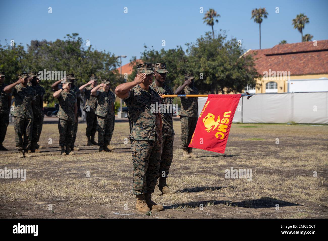 U.S. Marine Corps Gunnery Sgt. Gustavo Brown, left, and Cpl. Joseph Dixon with Headquarters and Service Battalion, present arms during a change of command ceremony for Headquarters Company, Headquarters and Service Battalion, at Marine Corps Recruit Depot, San Diego, July 28, 2022. The ceremony was representing the transfer of command for Headquarters Company, Headquarters and Service Battalion from Maj. Rork to Maj. Hopkins. Stock Photo