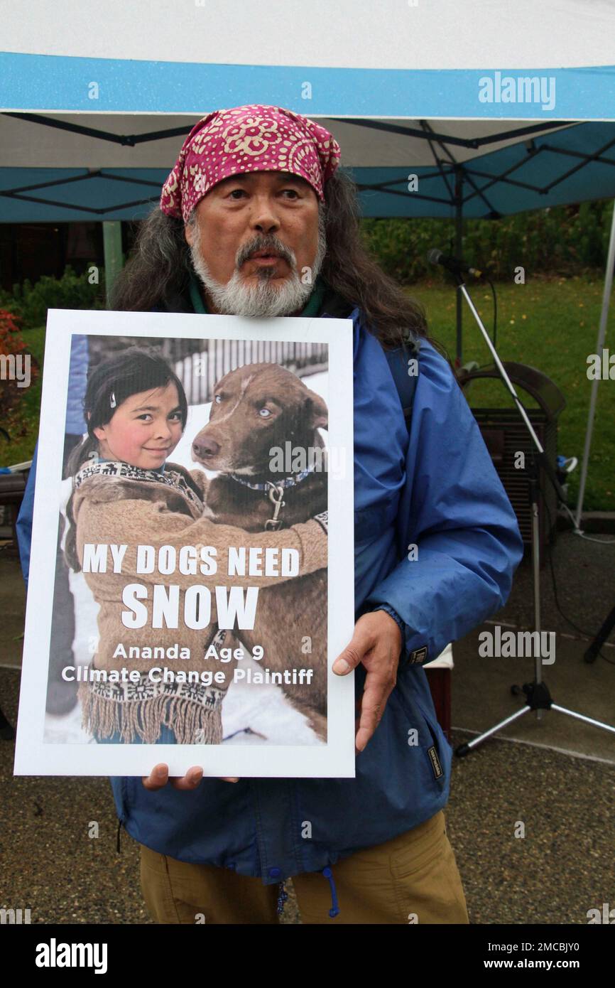 FILE Dune Lankard of Cordova, Alaska, holds a sign showing his