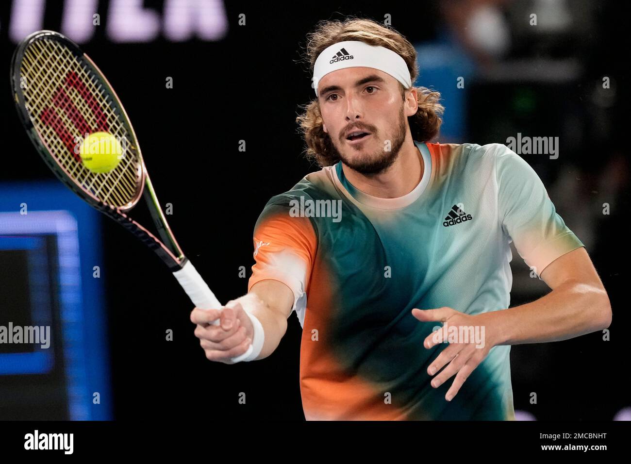 Stefanos Tsitsipas of Greece plays a forehand return to Daniil Medvedev of Russia during their semifinal match at the Australian Open tennis championships in Melbourne, Australia, Friday, Jan
