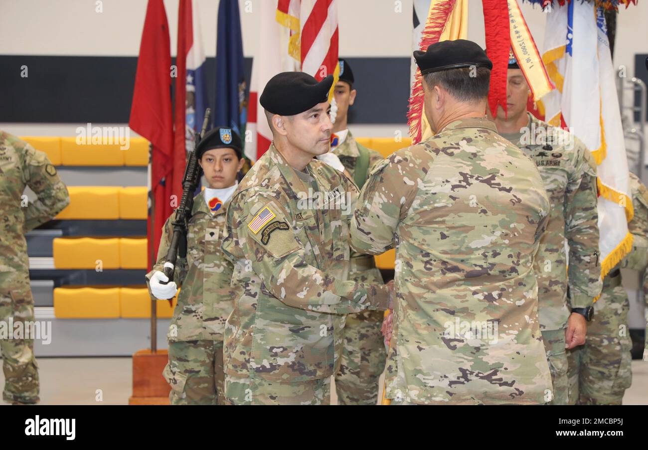 Brig. Gen. Frederick L. Crist, commanding general, 19th Expeditionary Sustainment Command, accepts the command colors from Lt. Gen. Willard M. Burleson III, commanding general, Eighth Army, during a change of command ceremony on Camp Walker, Republic of Korea. Brig. Gen. Steven L. Allen relinquished command during the ceremony, which also featured Eighth Army's Combined Forces Band. Stock Photo
