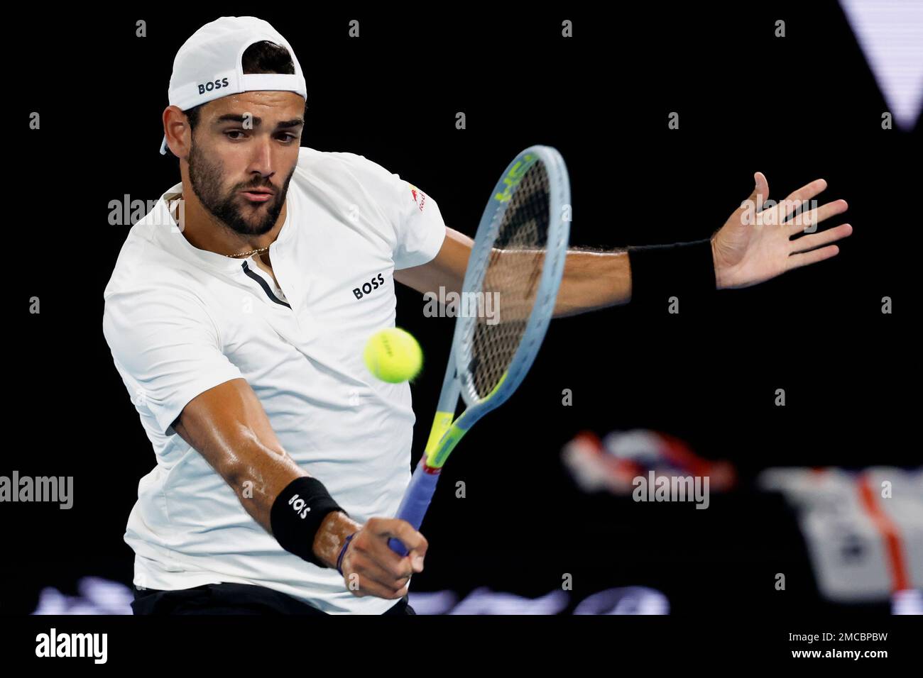 Matteo Berrettini of Italy plays a backhand return to Rafael Nadal of Spain during their semifinal match at the Australian Open tennis championships in Melbourne, Australia, Friday, Jan