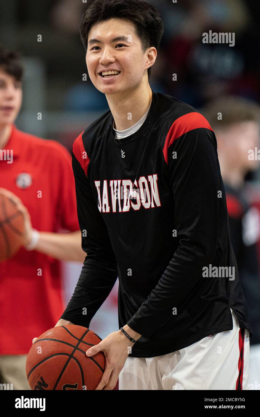 Davidson guard Hyunjung Lee warms up before the first half of an NCAA  college basketball game against the Virginia Commonwealth Rams in Davidson,  ., Wednesday, Jan. 26, 2022. (AP Photo/Jacob Kupferman Stock
