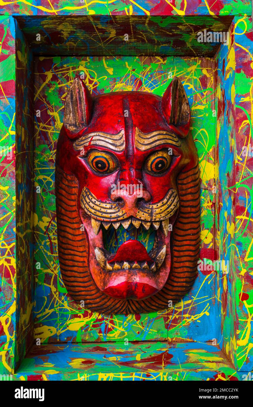 Red Cat Mask In Painted Wooden Box Stock Photo