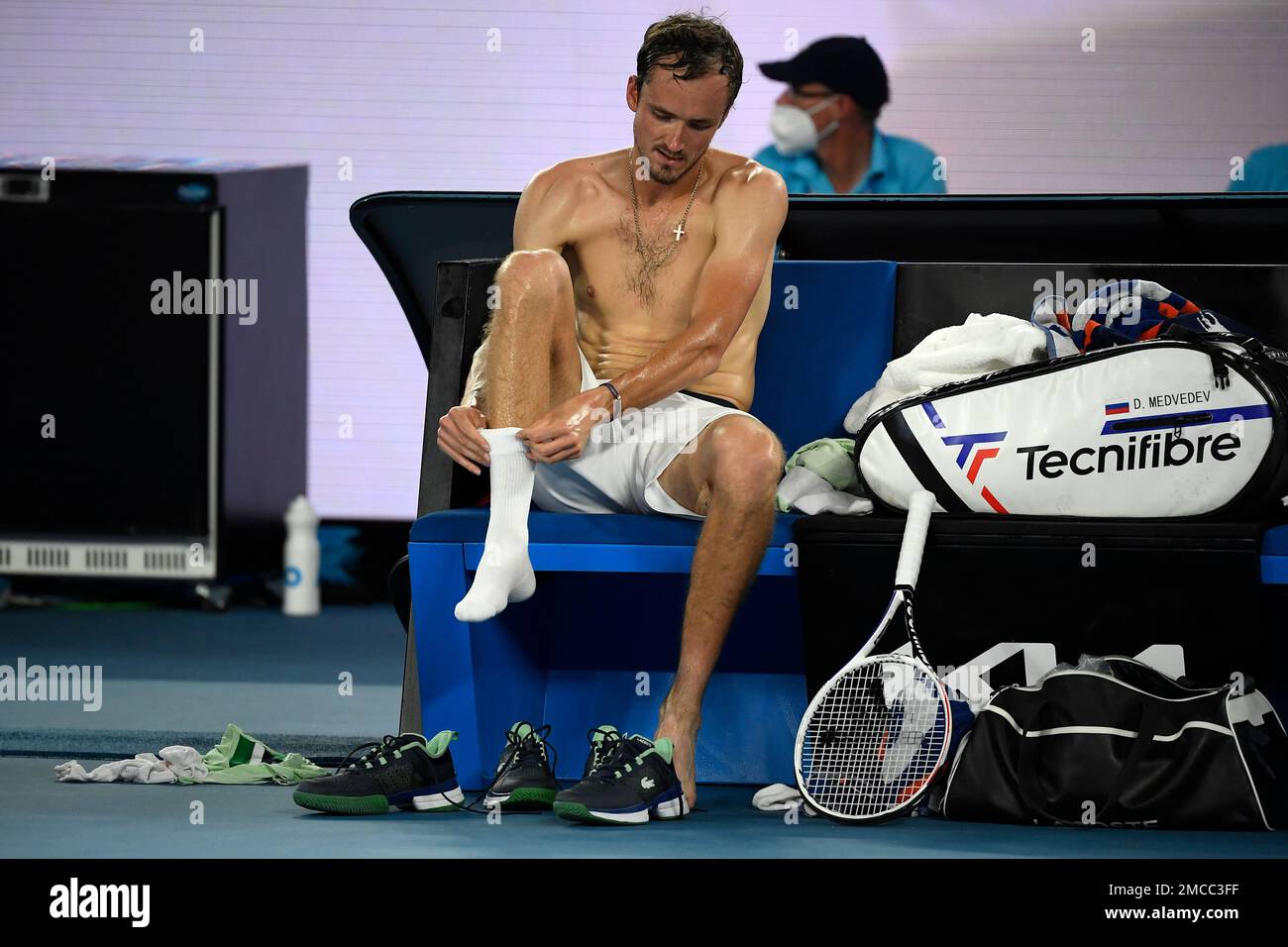 Daniil Medvedev of Russia changes his shirt and socks during his quarterfinal against Felix Auger-Aliassime of Canada at the Australian Open tennis championships in Melbourne, Australia, Wednesday, Jan