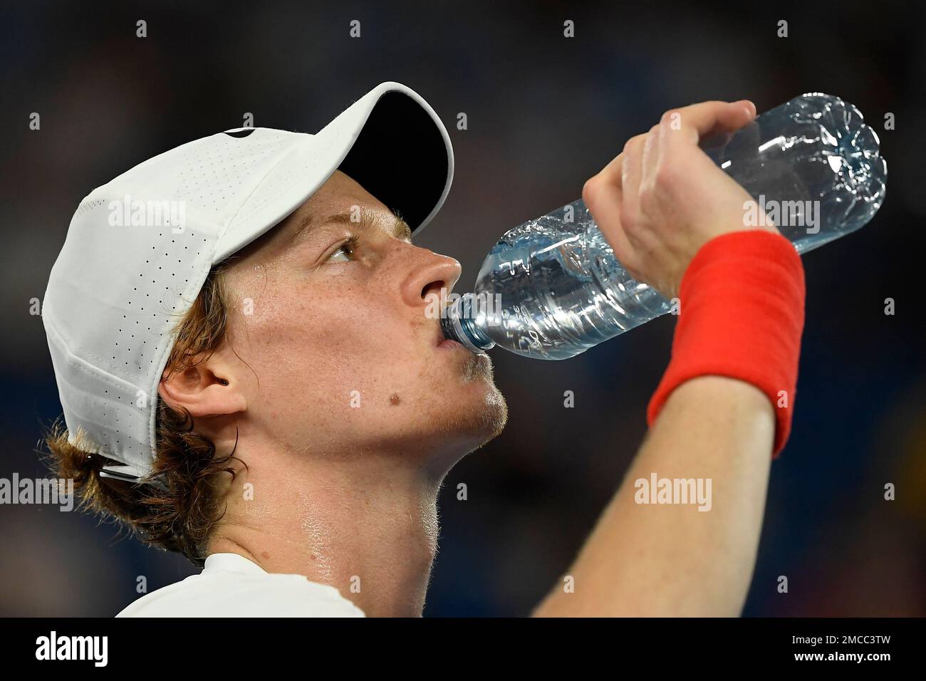 Jannik Sinner of Italy takes a drink during his quarterfinal match against  Stefanos Tsitsipas of Greece at the Australian Open tennis championships in  Melbourne, Australia, Wednesday, Jan. 26, 2022. (AP Photo/Andy Brownbill