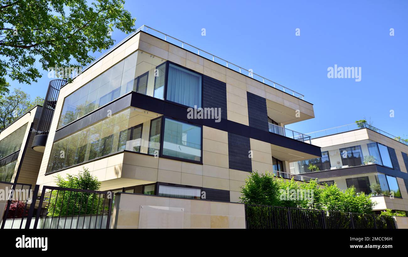 Picture of Eco architecture. Green tree and apartment building. The harmony of ...