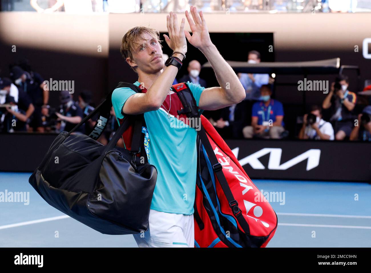 Denis Shapovalov of Canada gestures to the crowd following his defeat to Rafael Nadal of Spain during their quarterfinal match at the Australian Open tennis championships in Melbourne, Australia, Tuesday, Jan