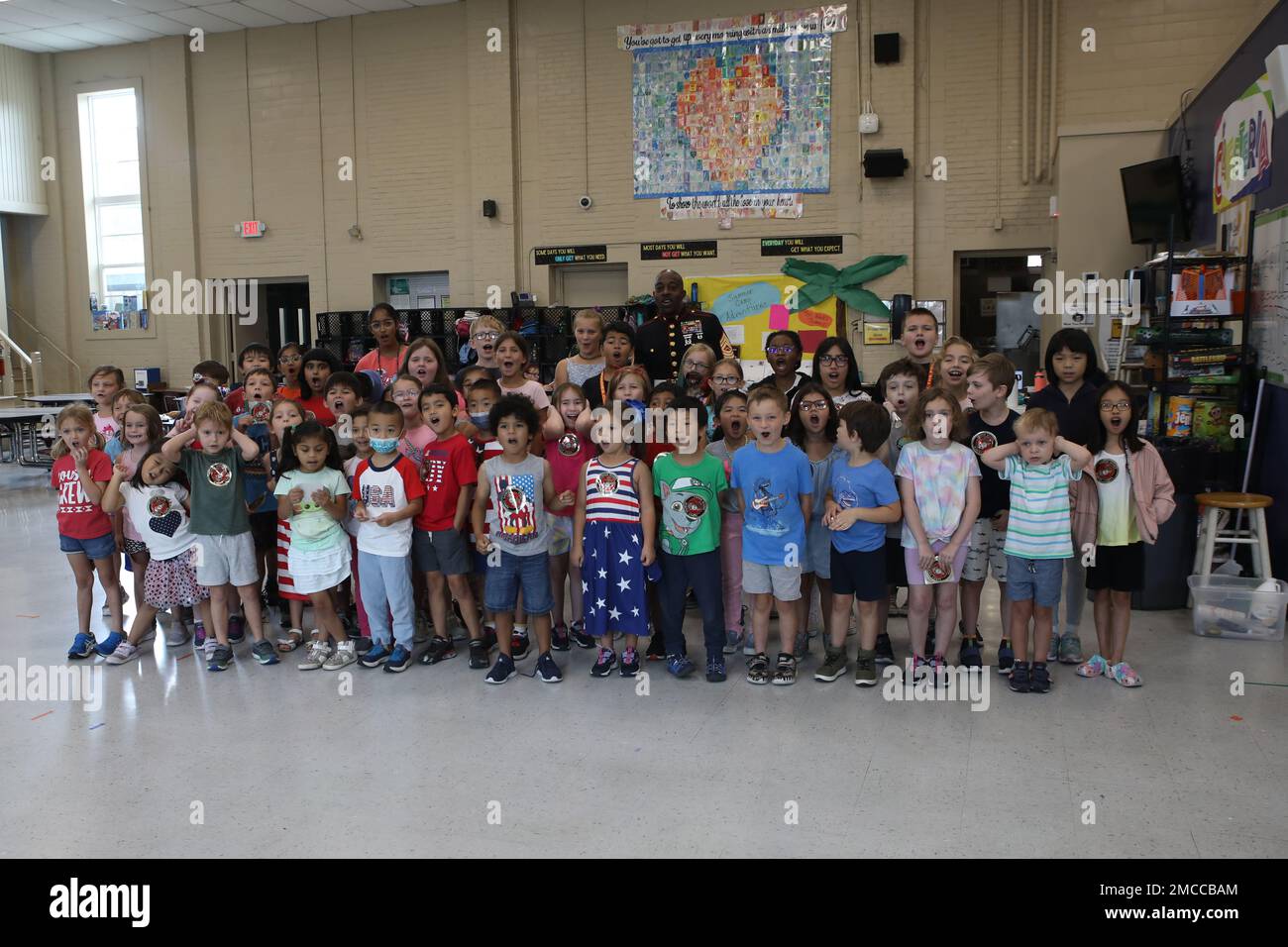 U.S. Marine Corps Master Sgt. Michael Johnson and a group of kids in