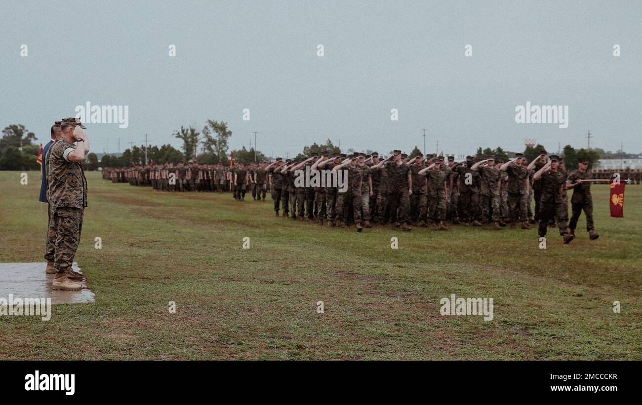 U.S. Marines with 6th Marine Regiment, 2d Marine Division, conduct a pass and review at a change of command ceremony on Camp Lejeune, North Carolina, June 29, 2022.  During the ceremony, Col. Jeffrey R. Kenney, the outgoing regimental commander of 6th Marines, relinquished command to Col. Gregory P. Gordon. Stock Photo
