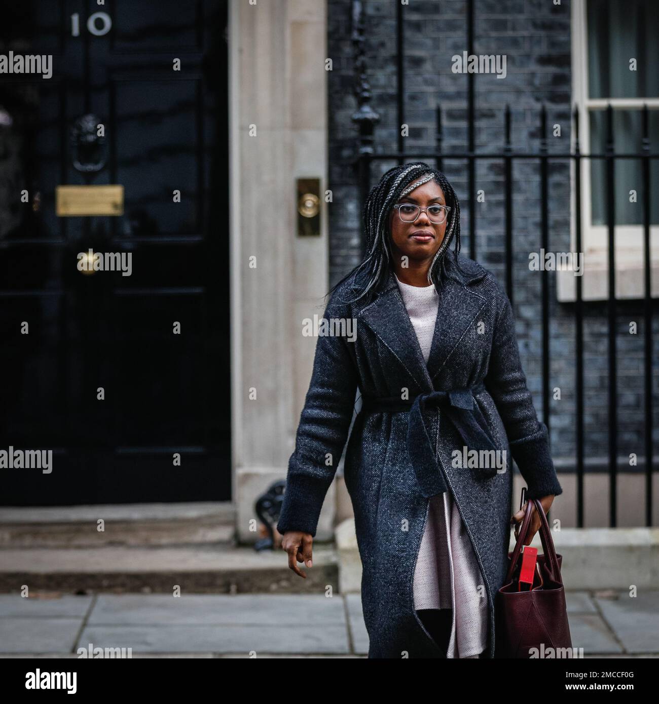 Kemi Badenoch, MP, Secretary of State for International Trade, looks at