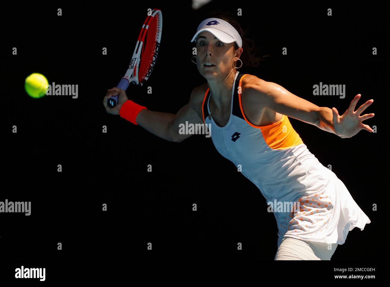 Alize of France makes a forehand return to Simona Halep of