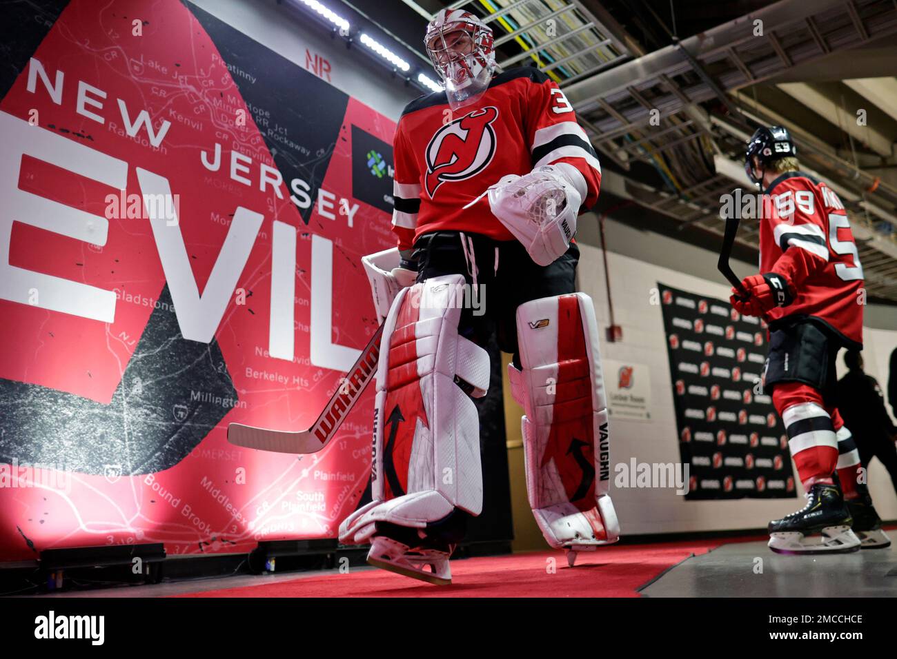 New Jersey Devils goaltender Jon Gillies walks to the ice to face the