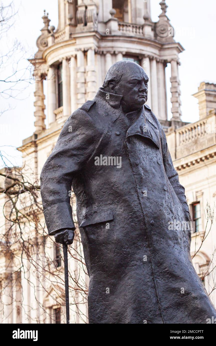 Sir Winston Churchill bronze statue in Parliament Square Gardens created by Ivor Roberts-Jones. Close up image with white building in background. Lond Stock Photo