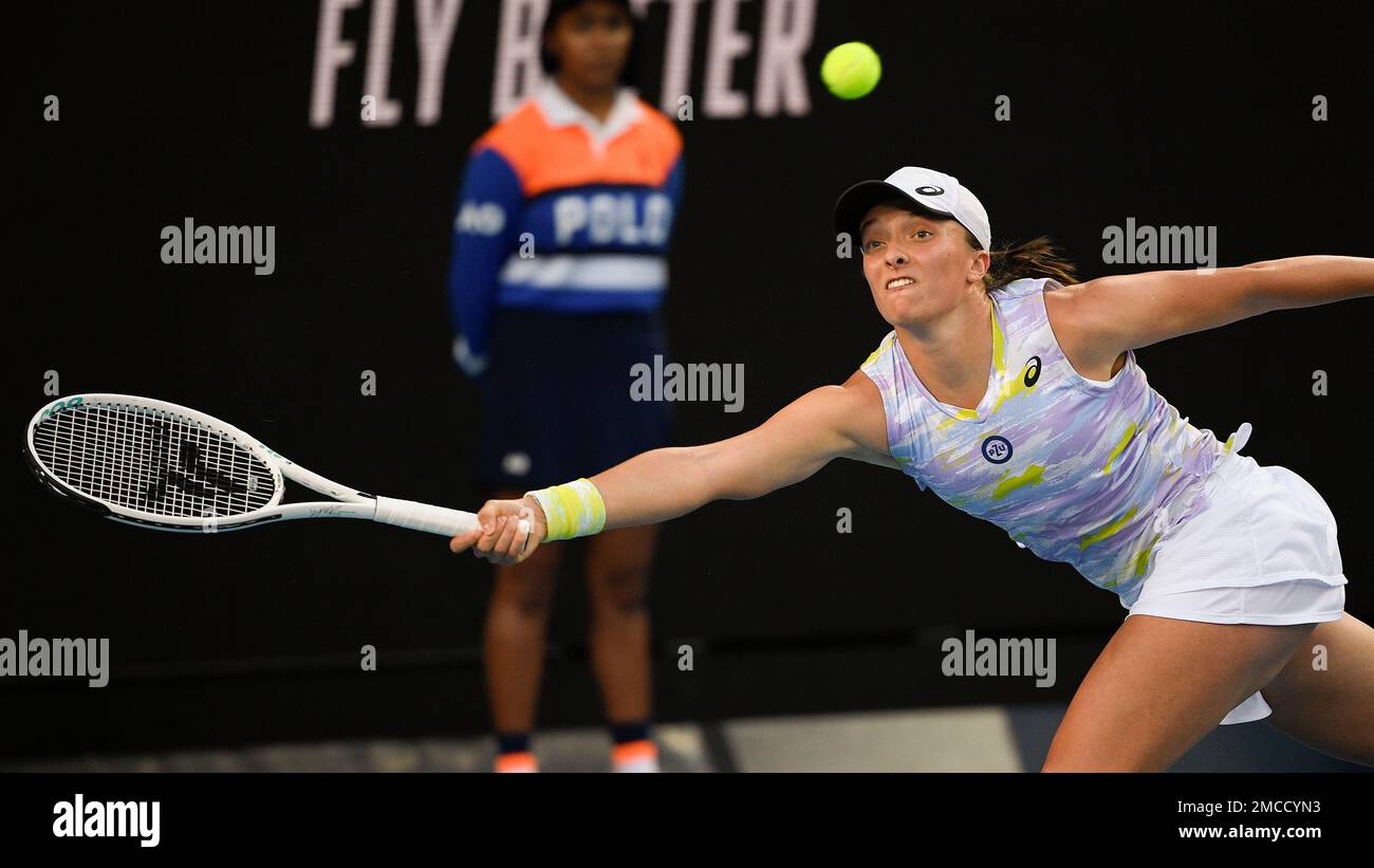 Iga Swiatek of Poland plays a forehand return to Daria Kasatkina of Russia during their third round match at the Australian Open tennis championships in Melbourne, Australia, Saturday, Jan