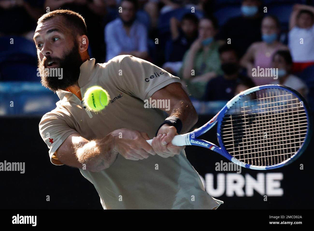 Benoit Paire of France plays a backhand return to Stefanos Tsitsipas of Greece during their third round match at the Australian Open tennis championships in Melbourne, Australia, Saturday, Jan