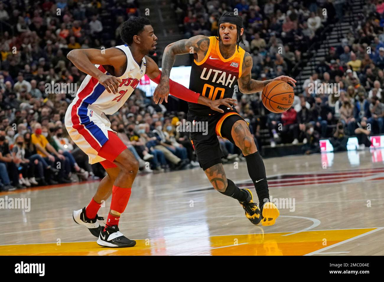 Detroit Pistons guard Josh Jackson, left, guards Utah Jazz guard Jordan