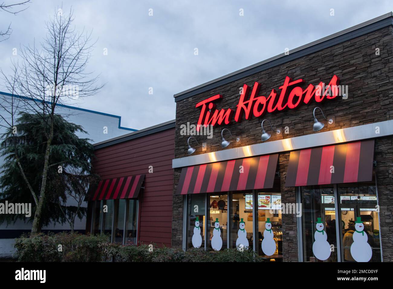 Sign of Tim Hortons. Tim Hortons Inc. is a Toronto based Canadian coffeehouse & restaurant chain. It’s Canada's largest quick-service restaurant chain Stock Photo