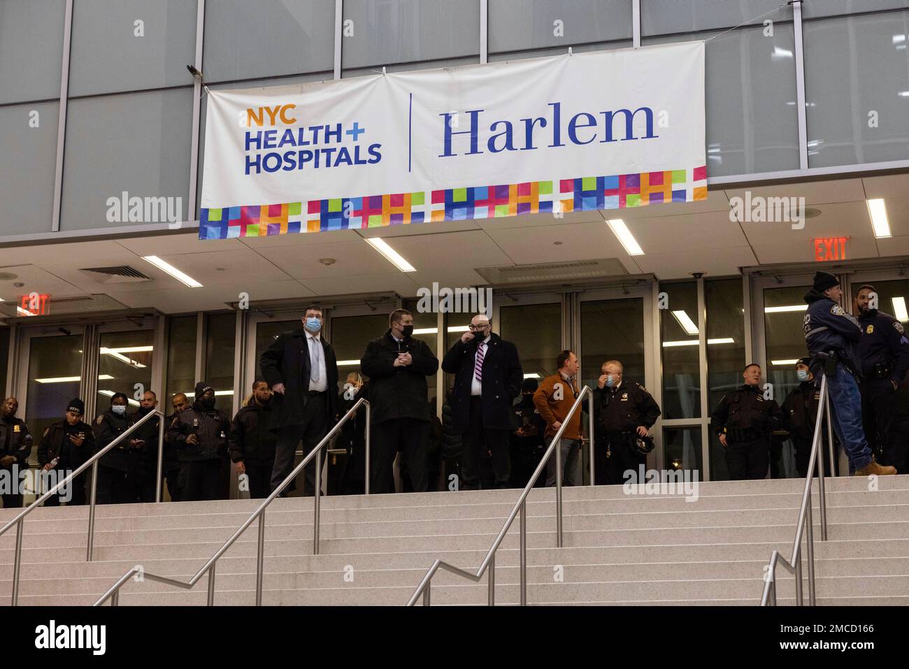 NYPD officers gather at Harlem Hospital after a shooting in Harlem on ...