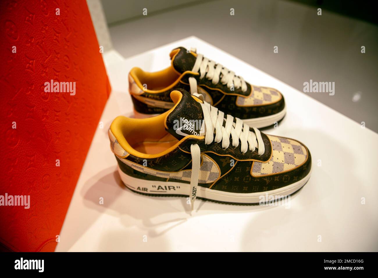 A pair of Louis Vuitton x Nike Air Force 1s sneakers by designer