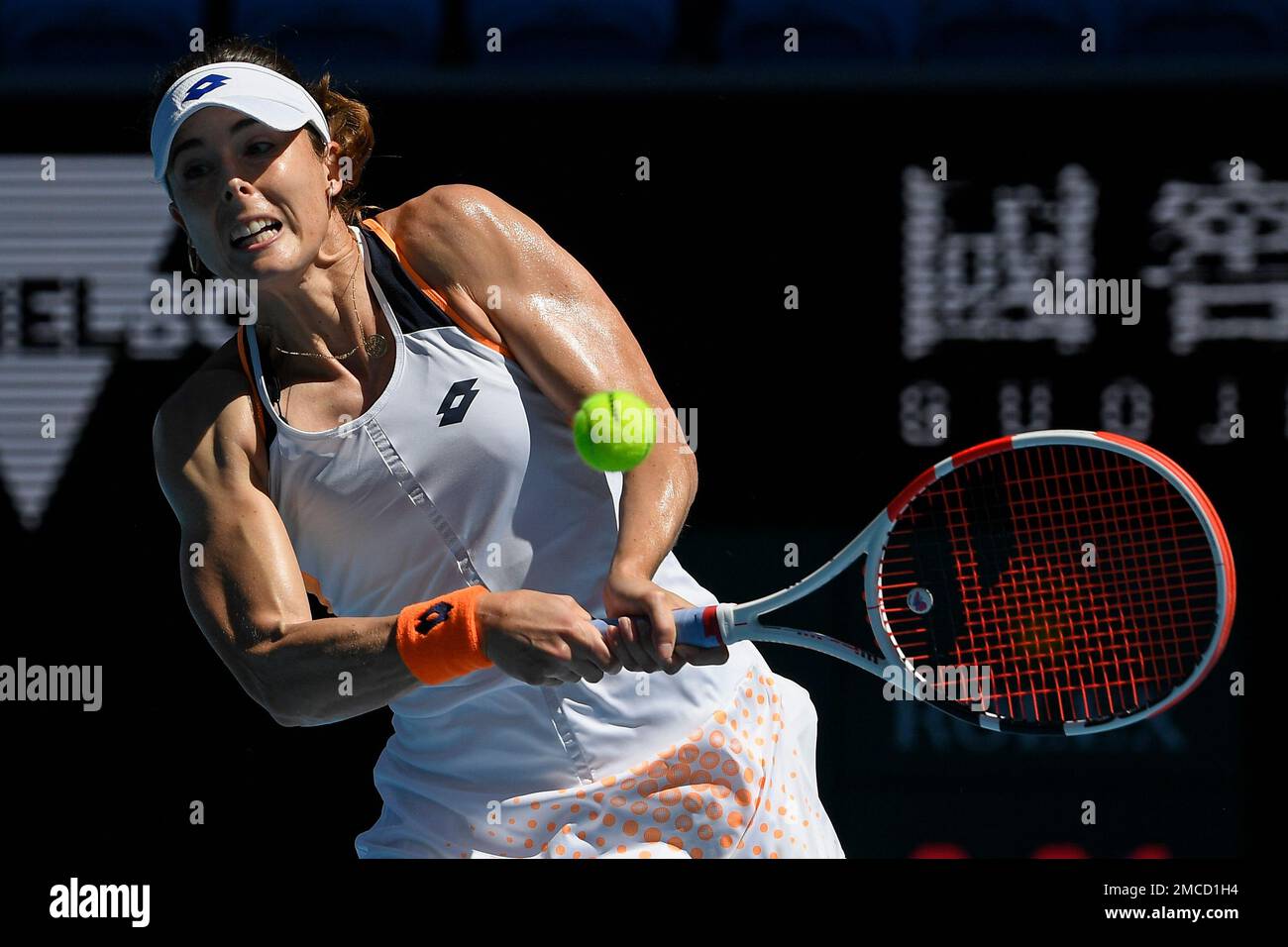 Alize of France plays a backhand return to Tamara Zidansek of