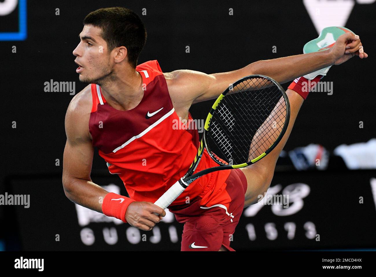 Carlos Alcaraz of Spain serves to Matteo Berrettini of Italy during their third round match at the Australian Open tennis championships in Melbourne, Australia, Friday, Jan