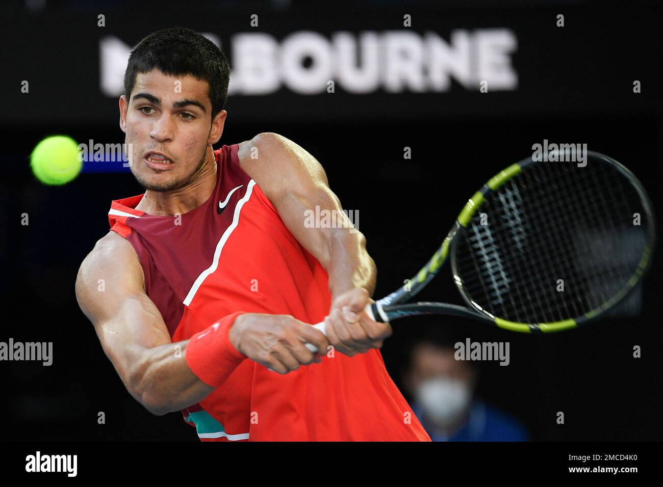 Carlos Alcaraz of Spain plays a backhand return to Matteo Berrettini of Italy during their third round match at the Australian Open tennis championships in Melbourne, Australia, Friday, Jan