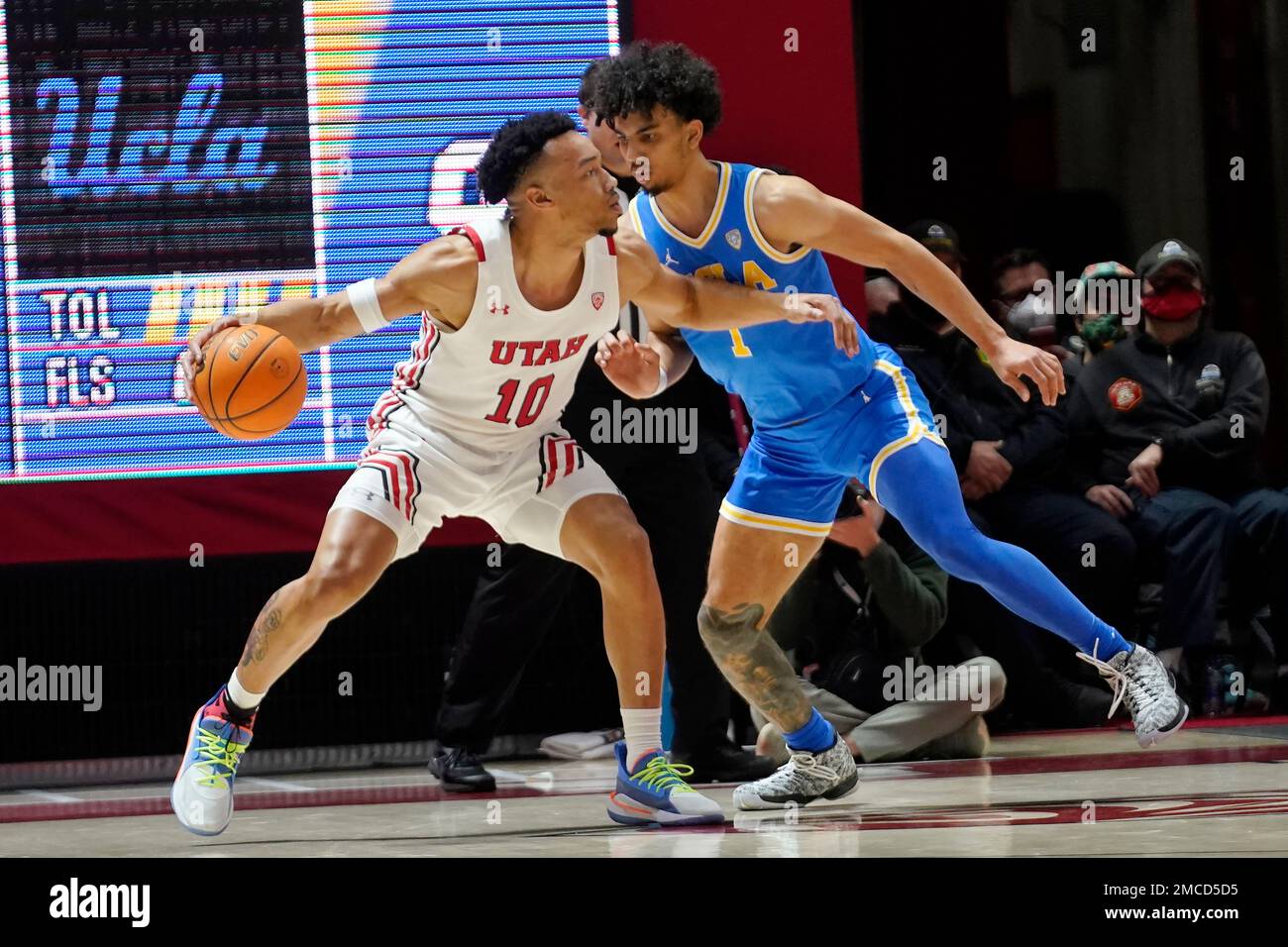 UCLA guard Jules Bernard (1) guards Utah guard Marco Anthony (10) during the first half of an