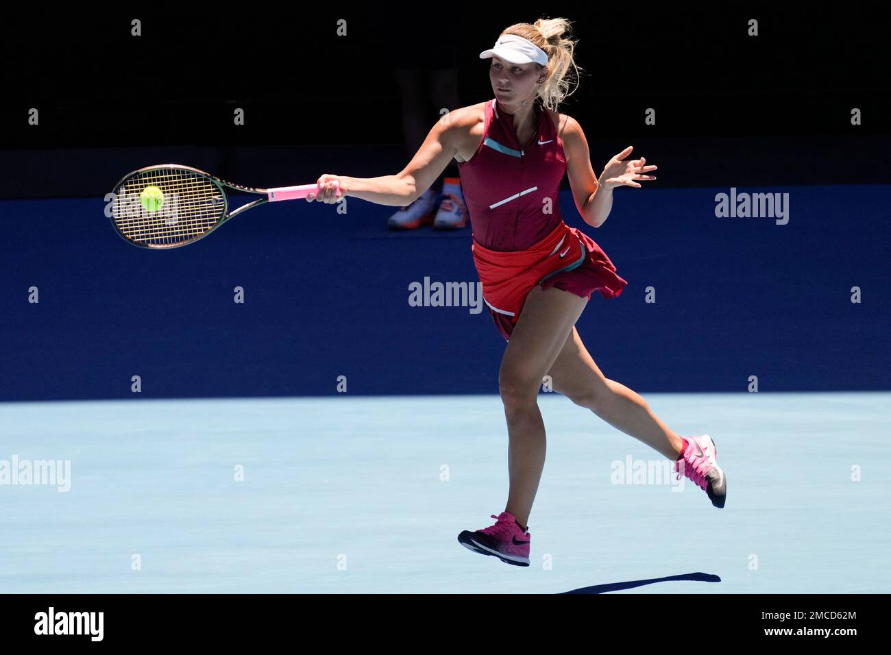 Marta Kostyuk of Ukraine plays a forehand return to Paula Badosa of