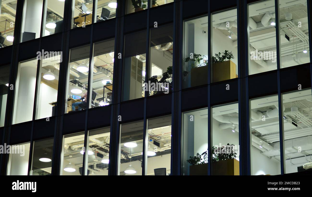 Modern office building in city at the night. View on illuminated