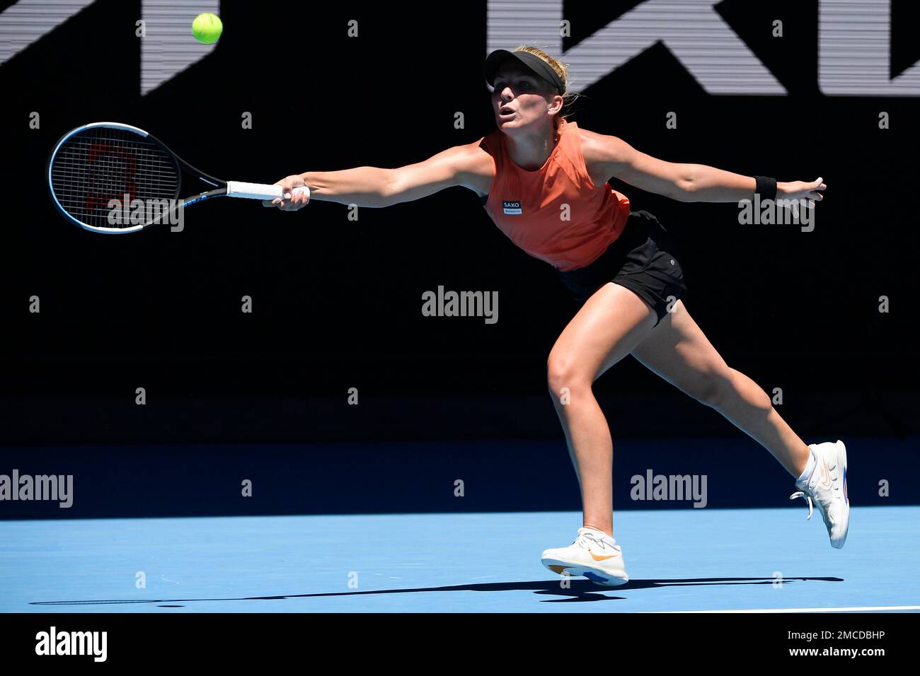 Maddison Inglis of Australia plays a forehand return to Hailey Baptiste