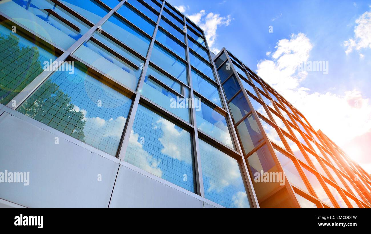 Abstract closeup of the glass-clad facade of a modern building covered ...