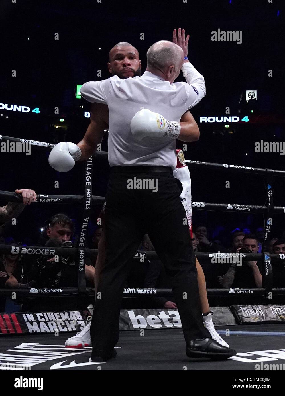 Referee Victor Loughlin gestures to Chris Eubank Jr to stop the fight