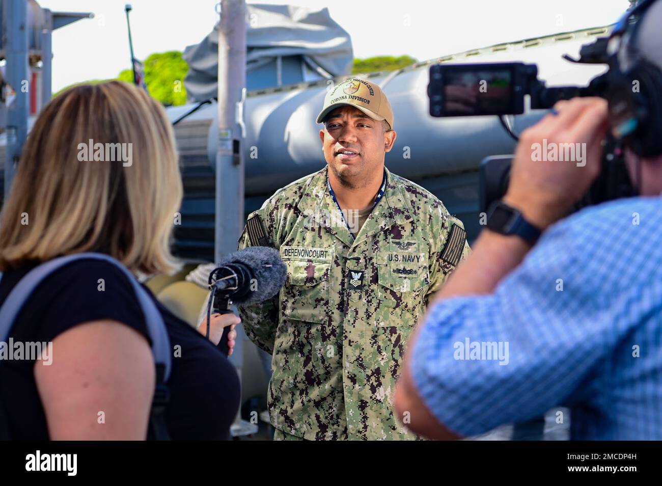 U.S. Navy Petty Officer 1st Class Guy Derenoncourt of Naval Surface Warfare Center, Corona Division engages in an interview aboard Arleigh Burke-class guided missile destroyer USS Fitzgerald (DDG 62) at Joint Base Pearl Harbor-Hickam, Hawaii, June 29, 2022. Derenoncourt was part of a team that installed a Ku Band satellite communications system, developed by the warfare center to allow for real-time streaming of missile telemetry data, on the Fitzgerald in preparation for the Pacific Dragon exercise.     Five nations are participating in PACDRAGON 2022 in and around the Hawaiian Islands in Aug Stock Photo