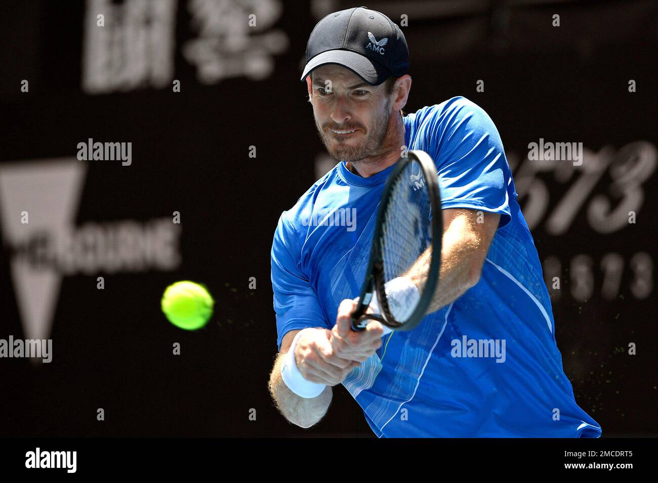 Andy Murray of Britain plays a backhand return to Nikoloz Basilashvili of Georgia during their first round match at the Australian Open tennis championships in Melbourne, Australia, Tuesday, Jan