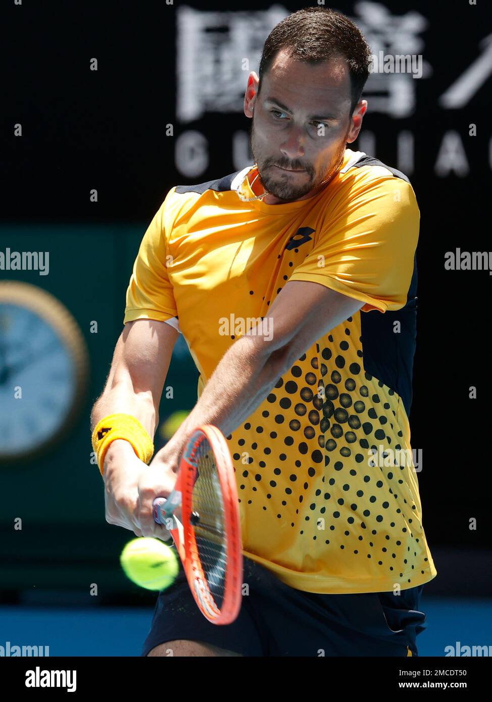 Gianluca Mager of Italy plays a backhand return to Andrey Rublev of Russia  during their first round match at the Australian Open tennis championships  in Melbourne, Australia, Tuesday, Jan. 18, 2022. (AP