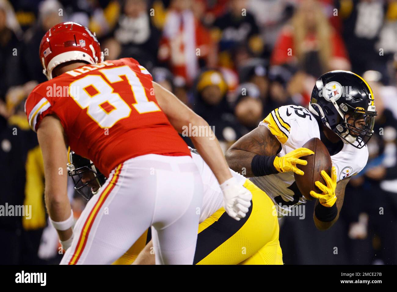 Pittsburgh Steelers inside linebacker Devin Bush (55) intercepts a pass  ahead of Kansas City Chiefs tight end Travis Kelce (87) during the first  half of an NFL wild-card playoff football game, Sunday,
