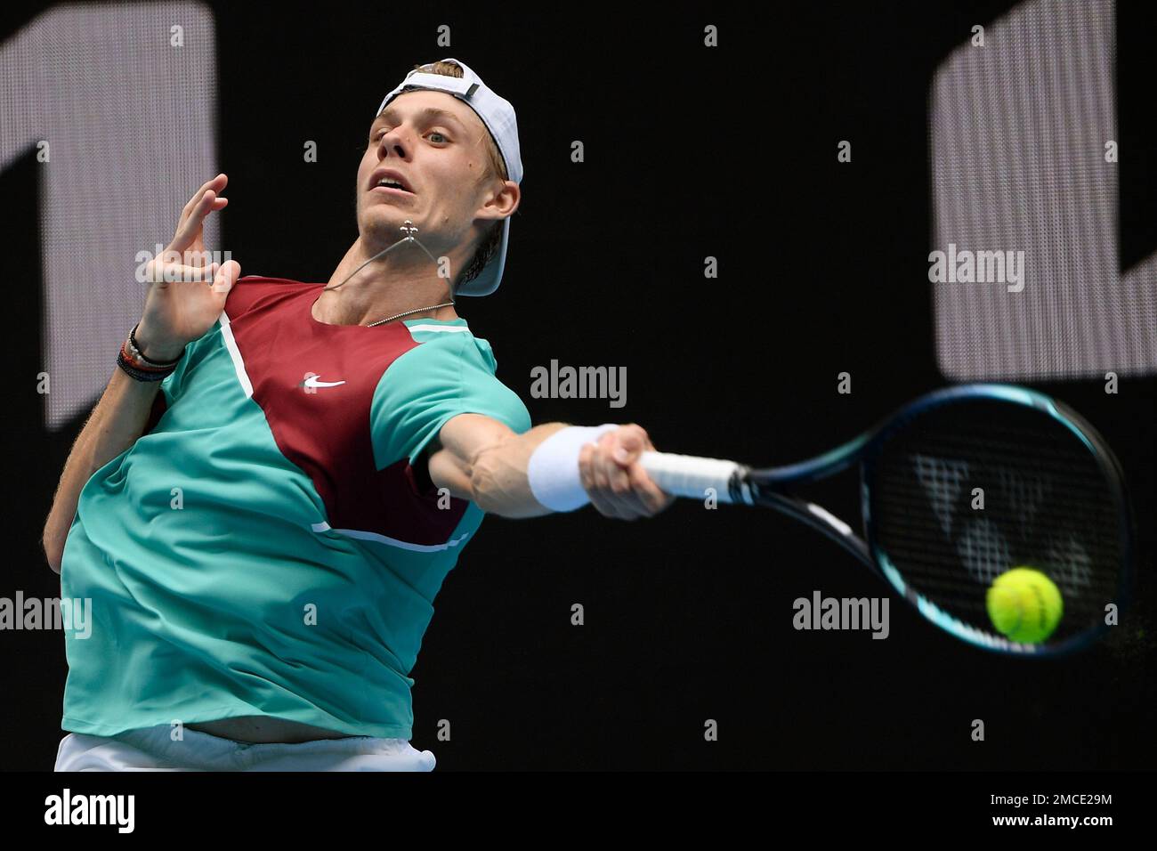 Denis Shapovalov of Canada plays a forehand return to Laslo Djere of Serbia during their first round match at the Australian Open tennis championships in Melbourne, Australia, Monday, Jan