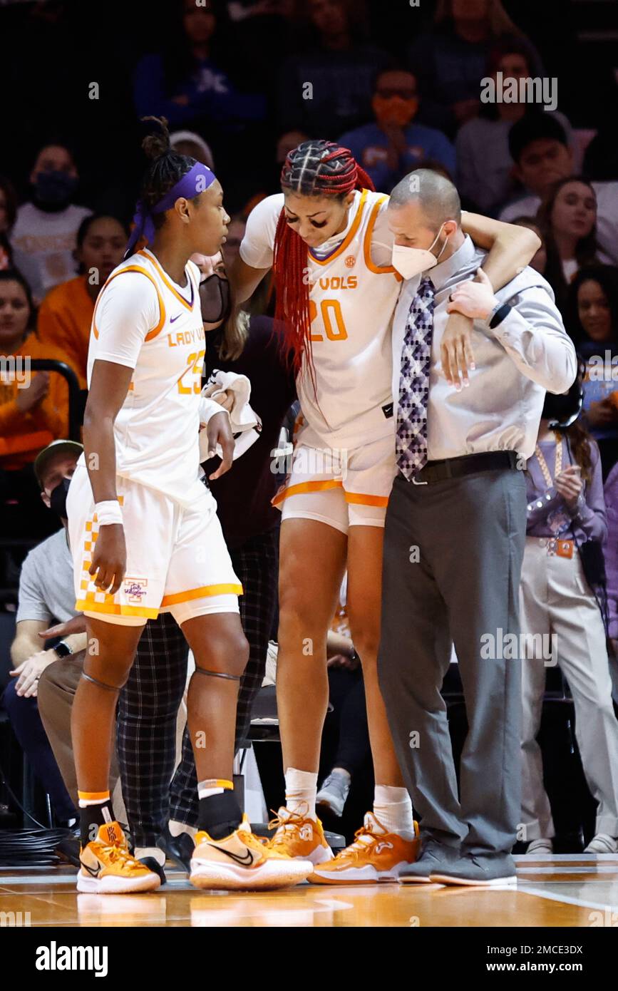 Tennessee center Tamari Key (20) is helped pff the court ...