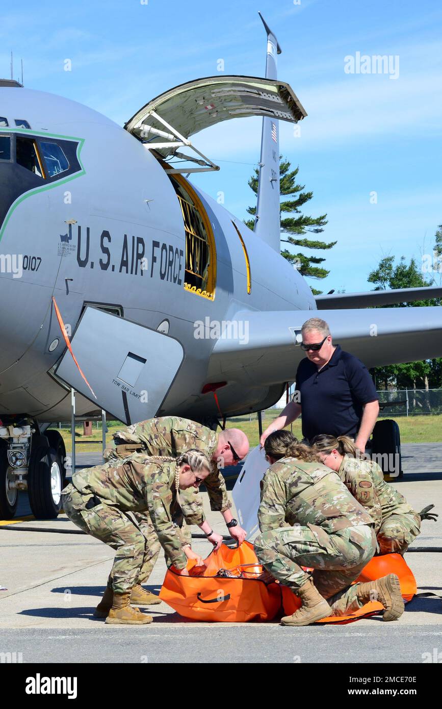 Airmen with the Maine Air National Guard’s 101st Air Refueling Wing’s (101 ARW) Medical Group and soldiers with the Maine Army National Guard’s 126th Aviation Regiment participated in a joint casualty evacuation training exercise, Bangor, ME JUN 29, 2022. During the exercise both airman and soldiers successfully secured and hoisted a simulated casualty multiple times through a side cargo door of a 101 ARW KC-135R before completing a continuous run-through starting with casualty movement from a 126th UH-60 Blackhawk to securing the casualty in a 101 ARW KC-135R aircraft. Stock Photo