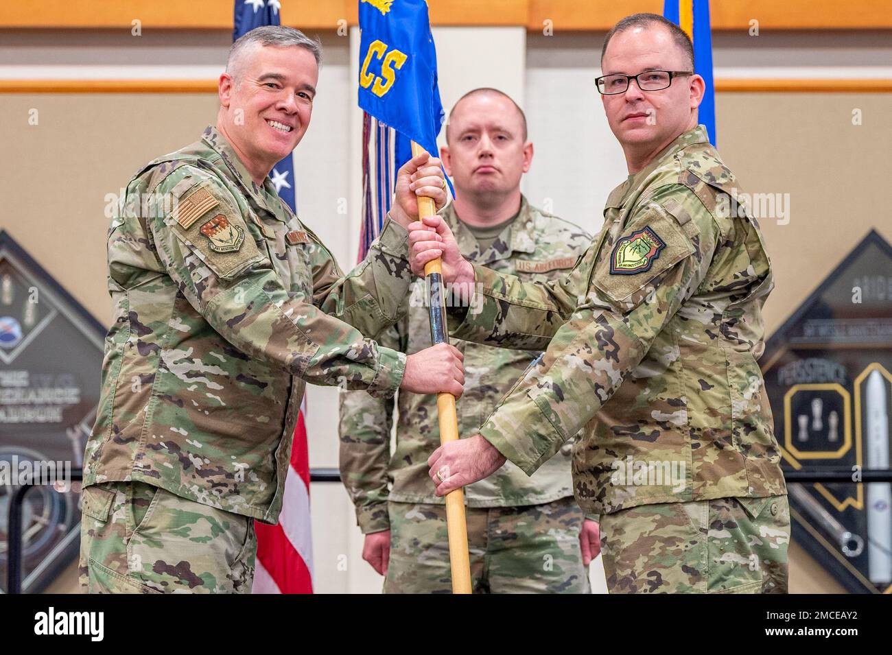 Maj. David Janowiak, right, accepts command of the 341st Communications
