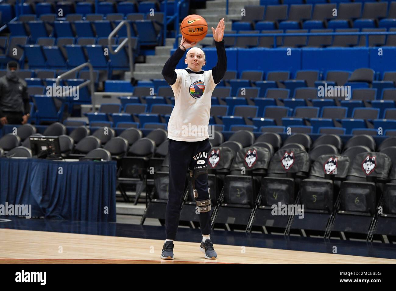 Off crutches, Connecticut's Paige Bueckers shoots prior to an NCAA