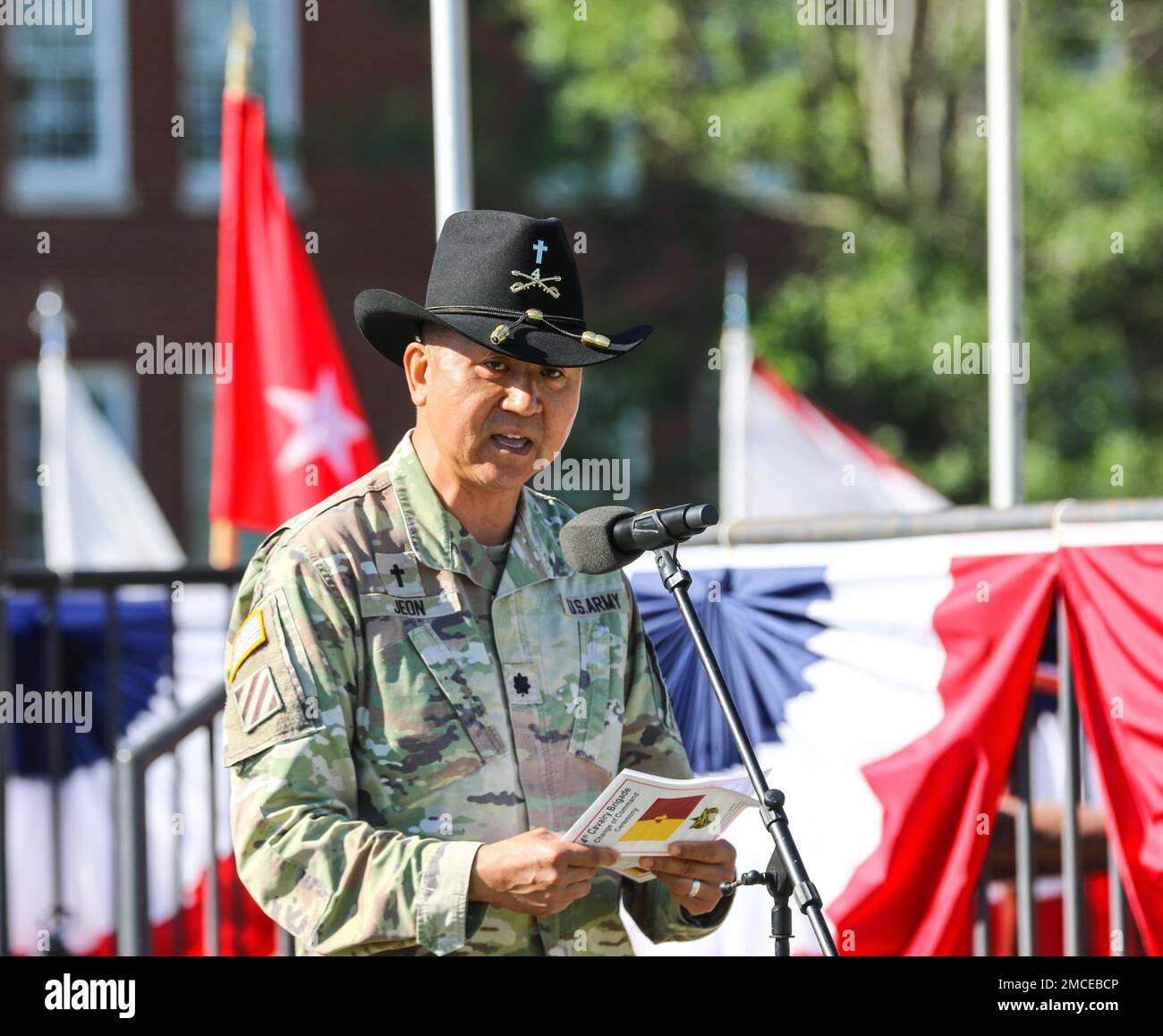 Chaplain (Lt. Col.) Phillip Jeon, U.S. Army Cadet Command, offers a prayer during the change of command ceremony for outgoing commander of 4th Cavalry Multi-Functional Training Brigade Col. Timothy Gallagher and incoming commander Col. Karen Baker. Stock Photo