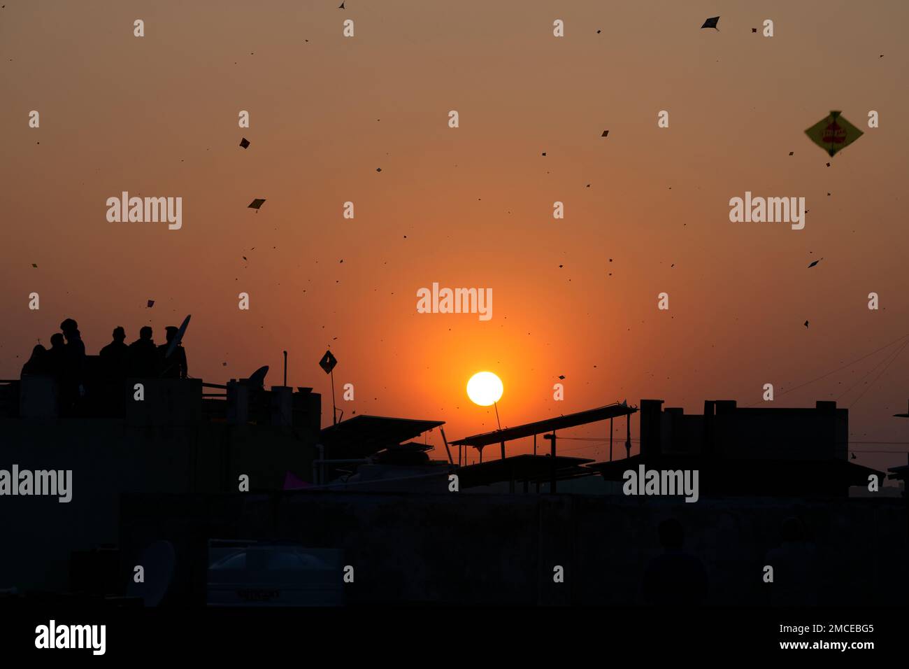 People fly kites during Uttarayan or Makar Sankranti festival in Ahmedabad, India, Friday, Jan