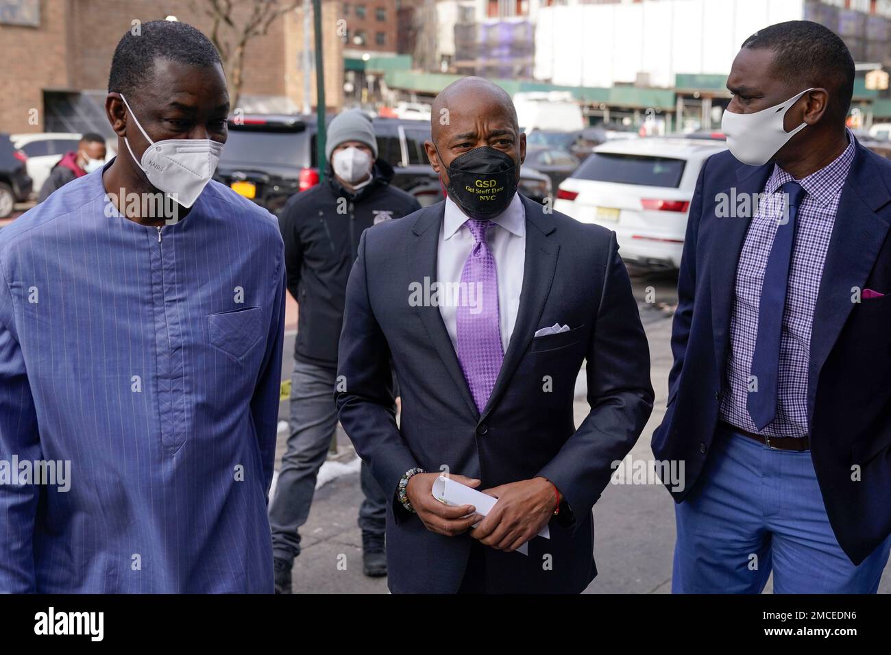 New York City Mayor Eric Adams, center, arrives to visit the MasjidUr