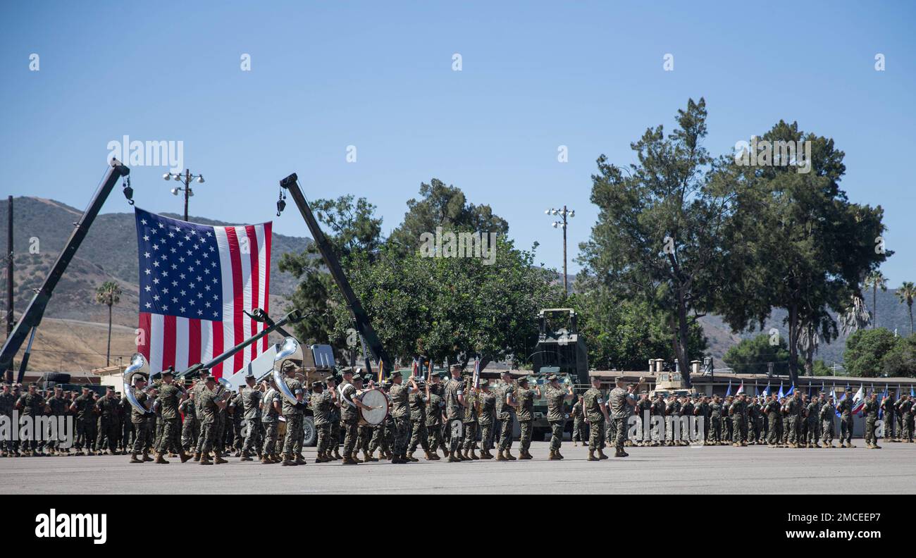U.S. Marines with the 1st Marine Division band, march in formation during a change of command ceremony at Marine Corps Base Camp Pendleton, California, June 30, 2022. During the ceremony, Col. Daniel Skuce relinquished command of 11th Marine Regiment to Col. Patrick Eldridge. Stock Photo